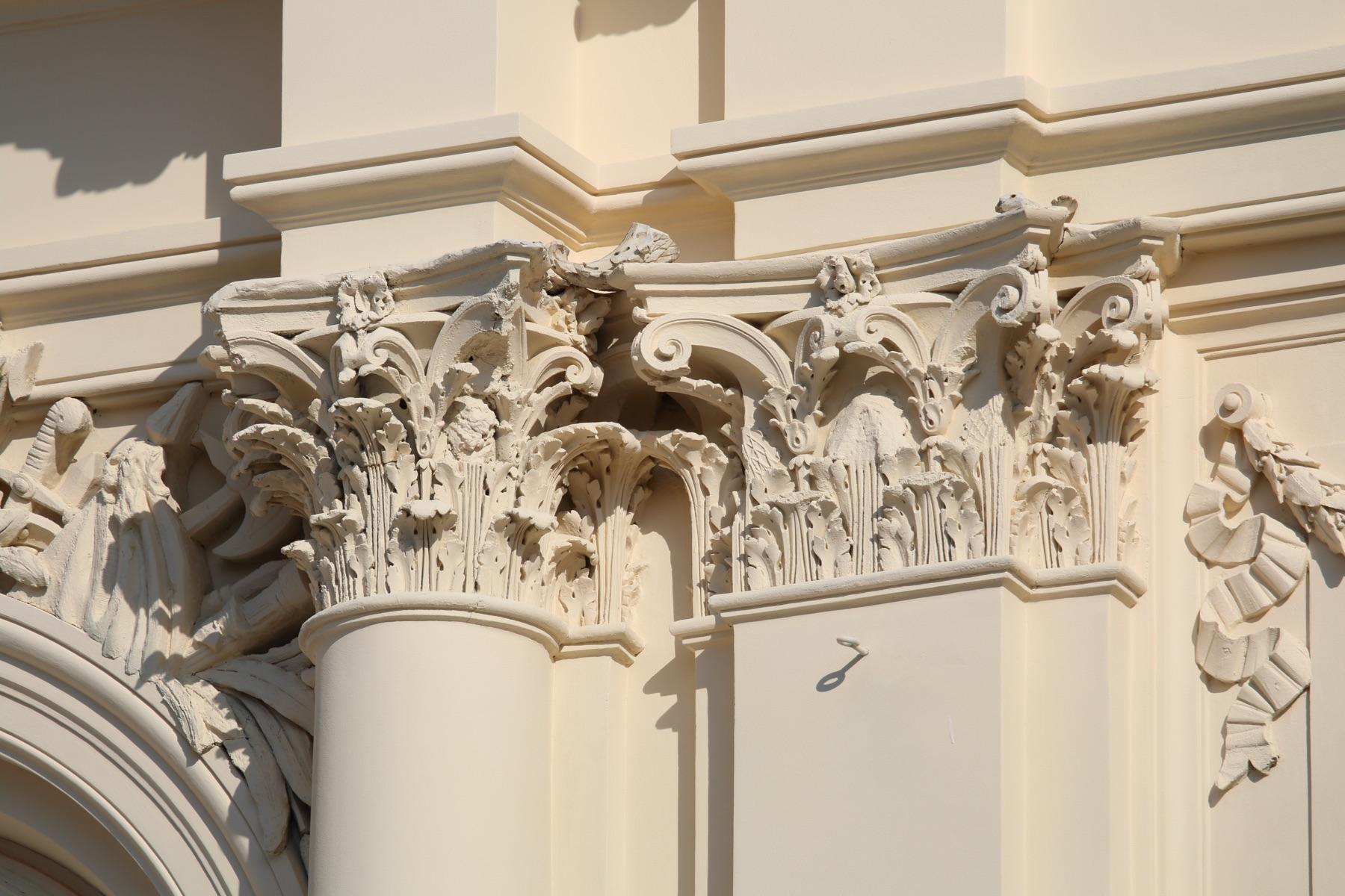 Pair of Corinthian capitals with acanthus leaves and volutes on a façade